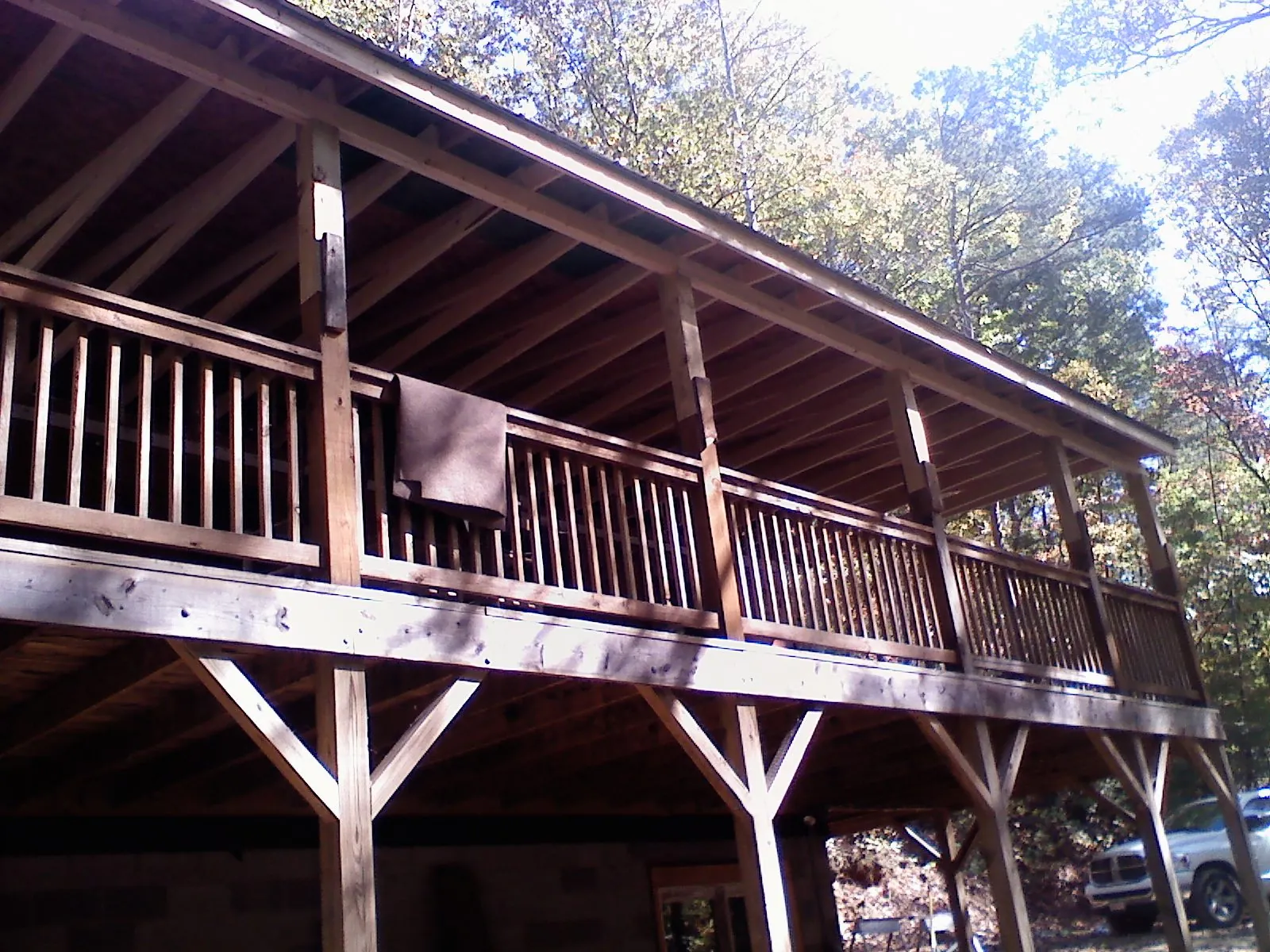 Timber framing under a new elevated porch and deck — Roof Leak Repair in Brush by Roofing Brothers